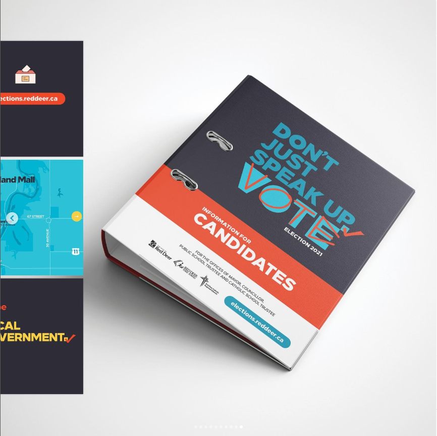A professionally photographed binder titled “Don’t Just Speak Up, Vote — Election 2021,” resting on a light background. The binder spine and cover read “Information for Candidates” and include the City of Red Deer logo, school board partner logos, and the website “elections.reddeer.ca.” The design features bold typography, checkmark motifs, and colour blocking in navy, teal, red, and white, indicating its use as an official reference document for candidates.